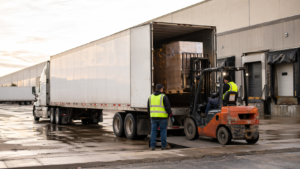 Full truckload shipping truck at a logistics warehouse representing FTL shipping companies in the USA